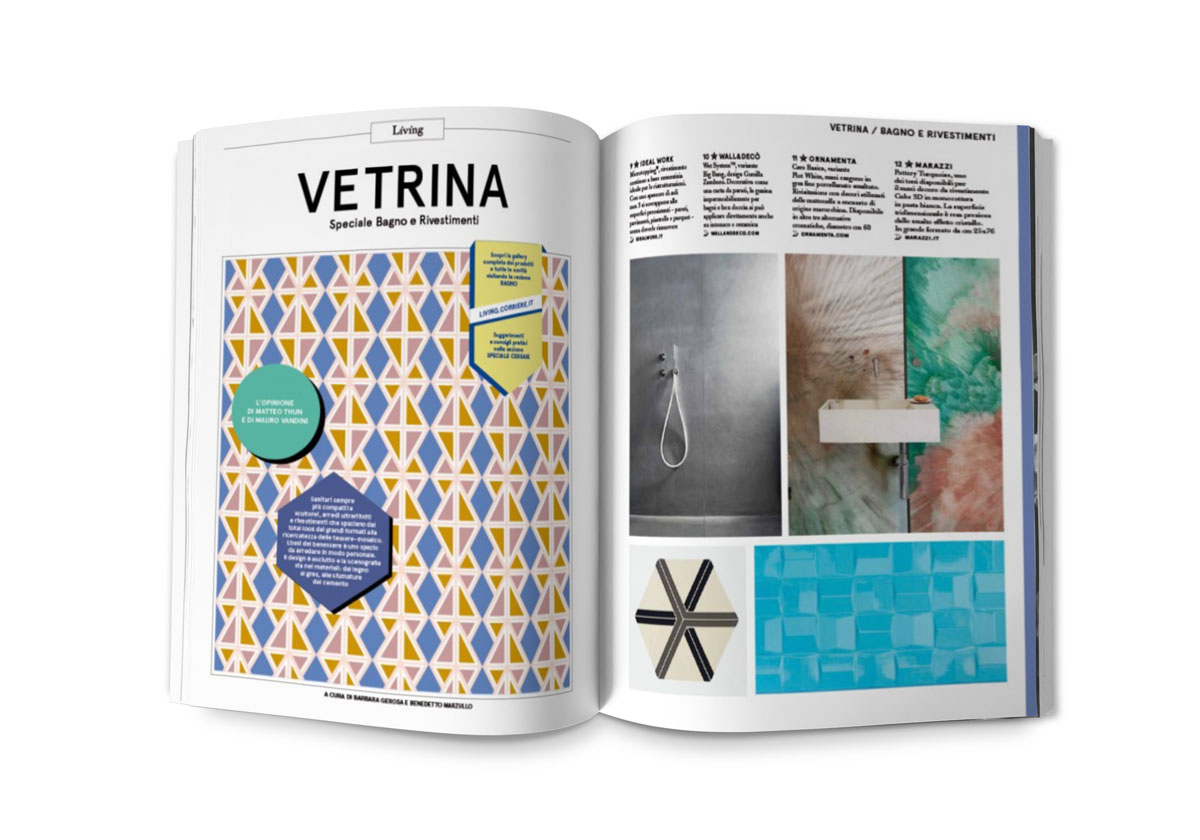 magazine ouvert présentant un article sur la salle de bain illustré par un motif géométrique coloré